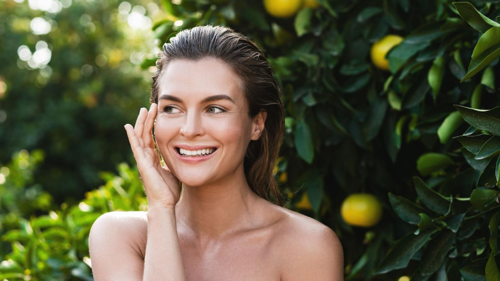 Woman with healthy, radiant skin after summer skin rejuvenation treatments for a natural glow and refreshed appearance.